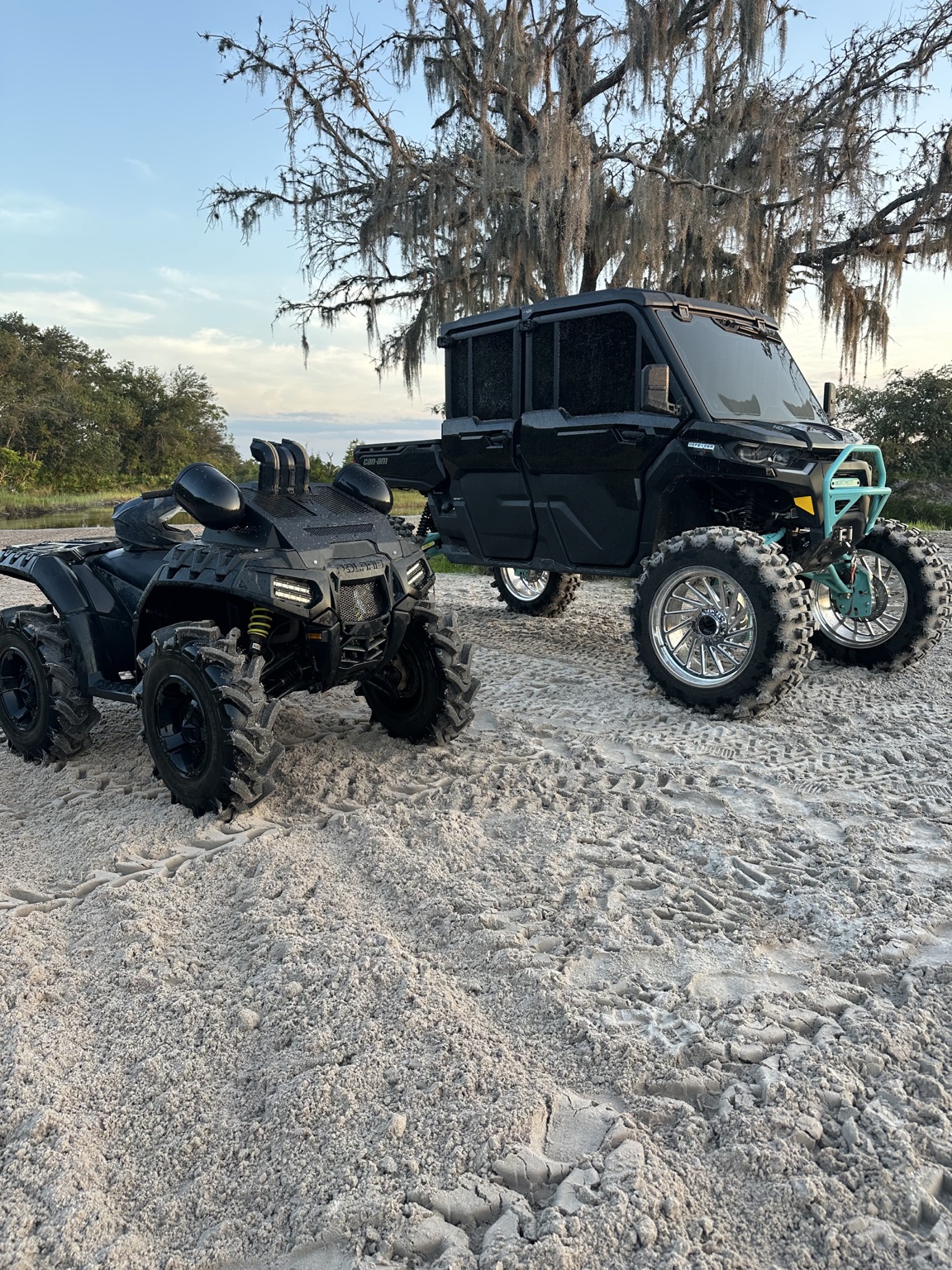 Lifted Can-Am Defender and Polaris ATV on a Florida trail